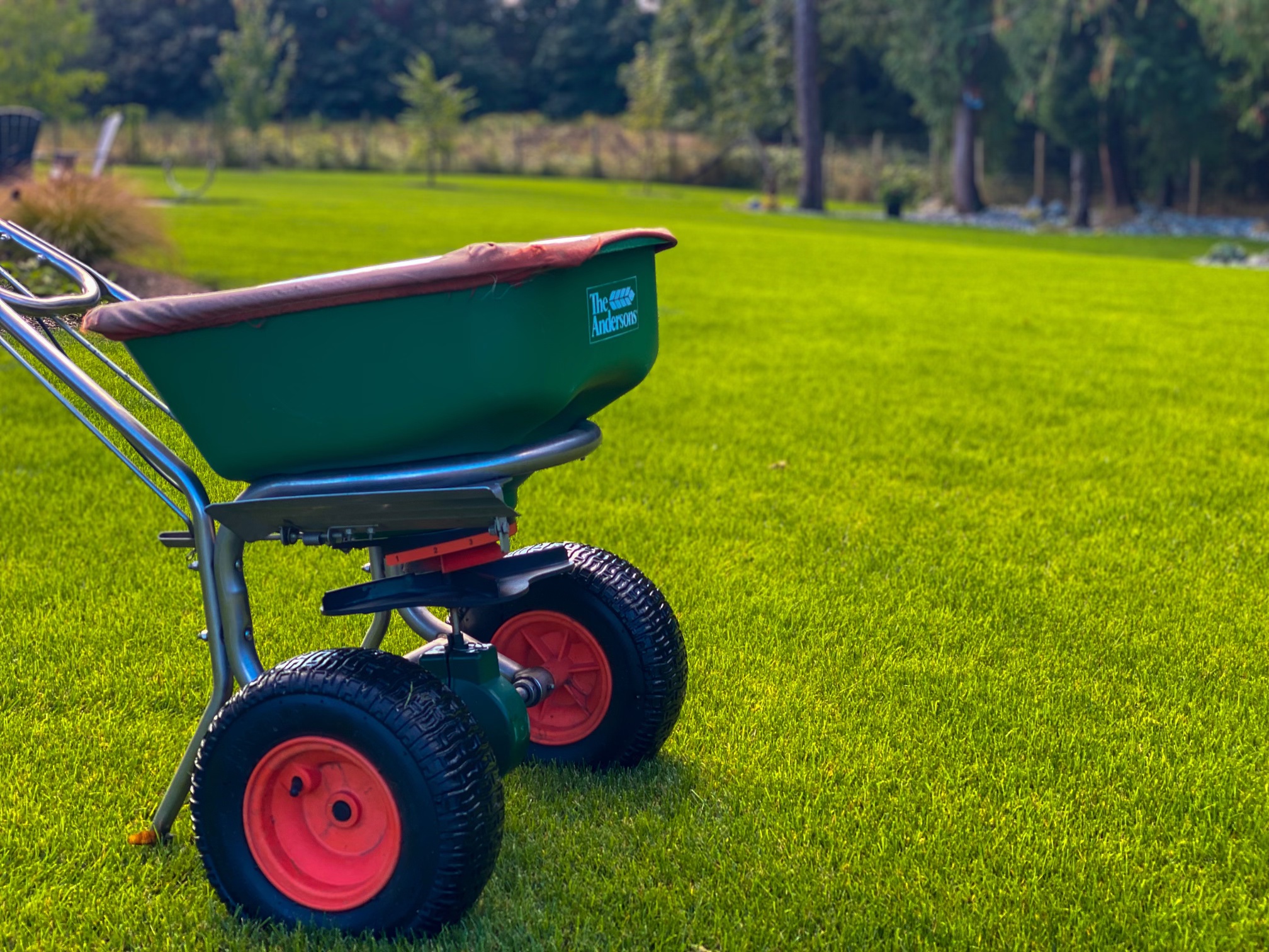 Bullyard spreader on pristine grass — Raincoast site prep