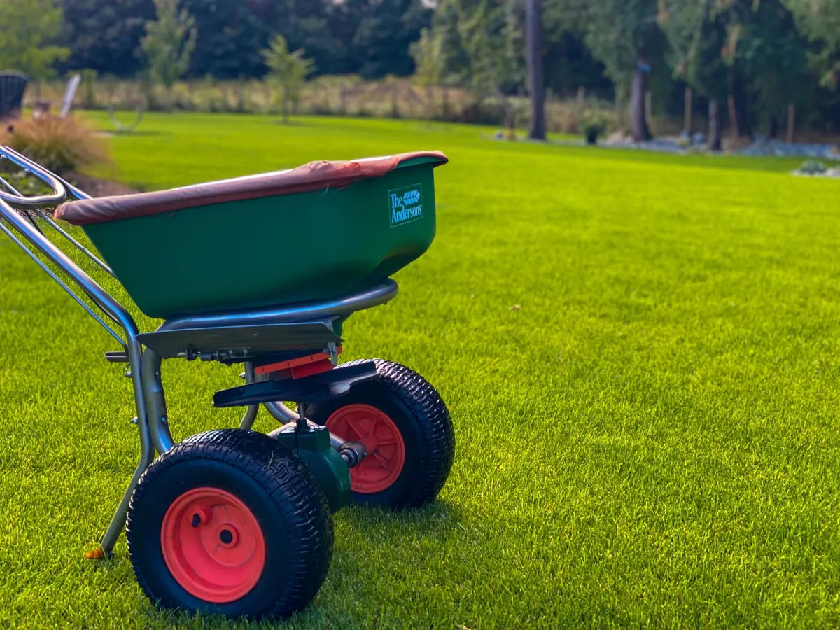 Bullyard spreader on pristine grass — Raincoast site prep