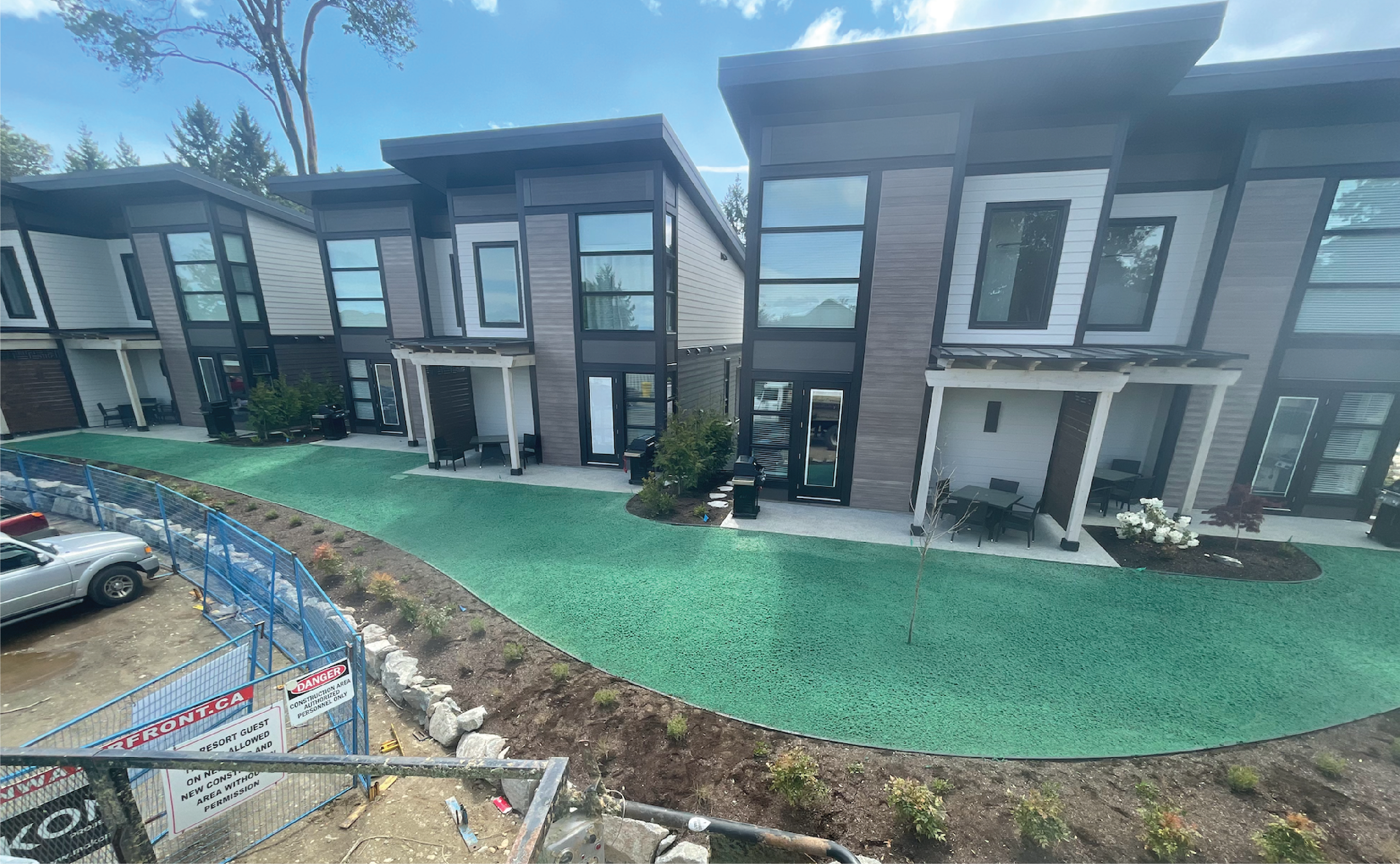 Modern townhome courtyard with completed hydroseed prep